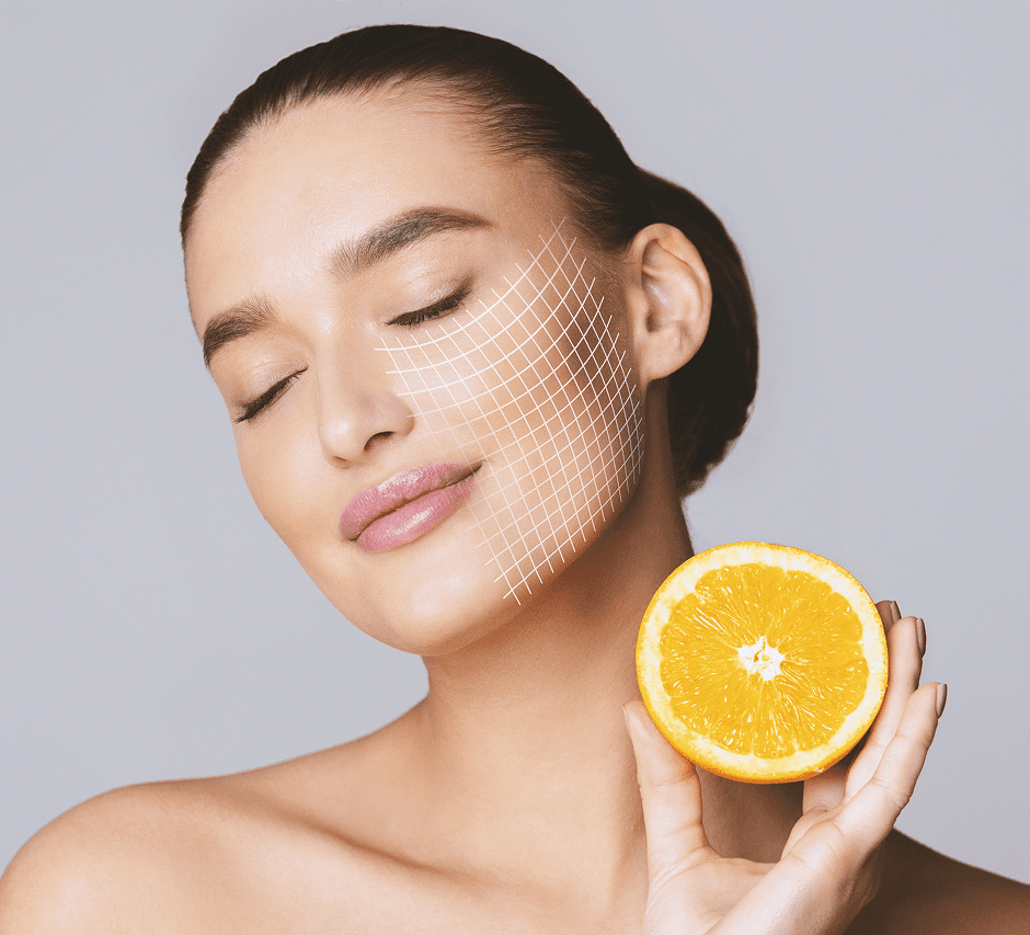 Woman holding orange, grid on face