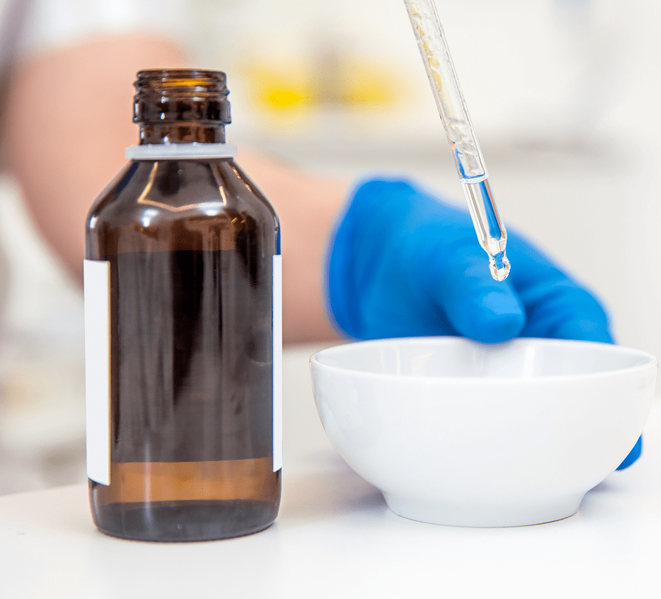 Liquid being transferred with dropper tool