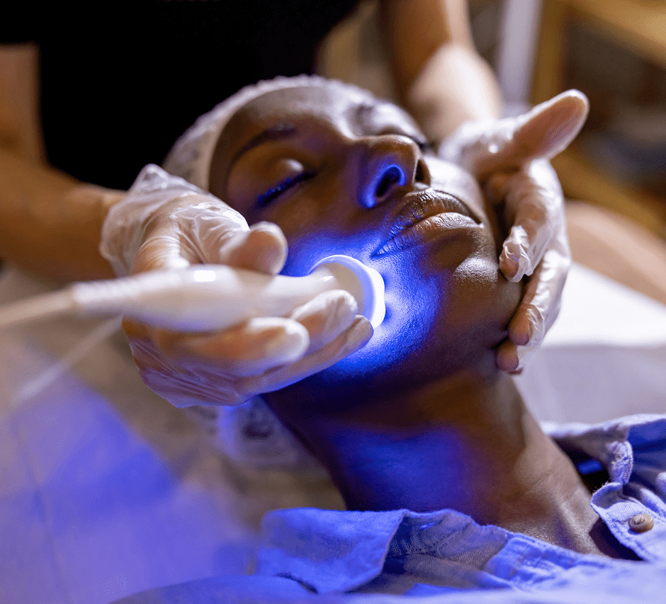 Woman receiving facial light therapy