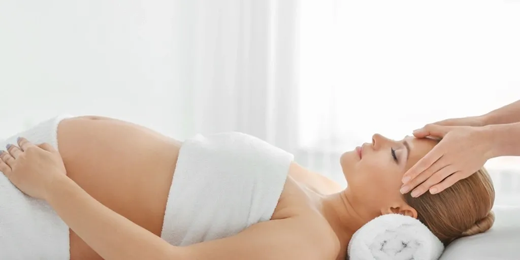 Pregnant woman receiving a relaxing massage