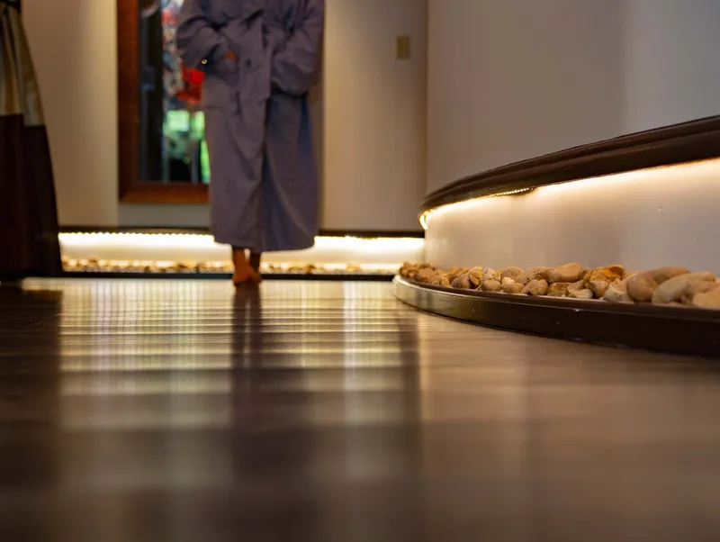 Person walking in a spa hallway